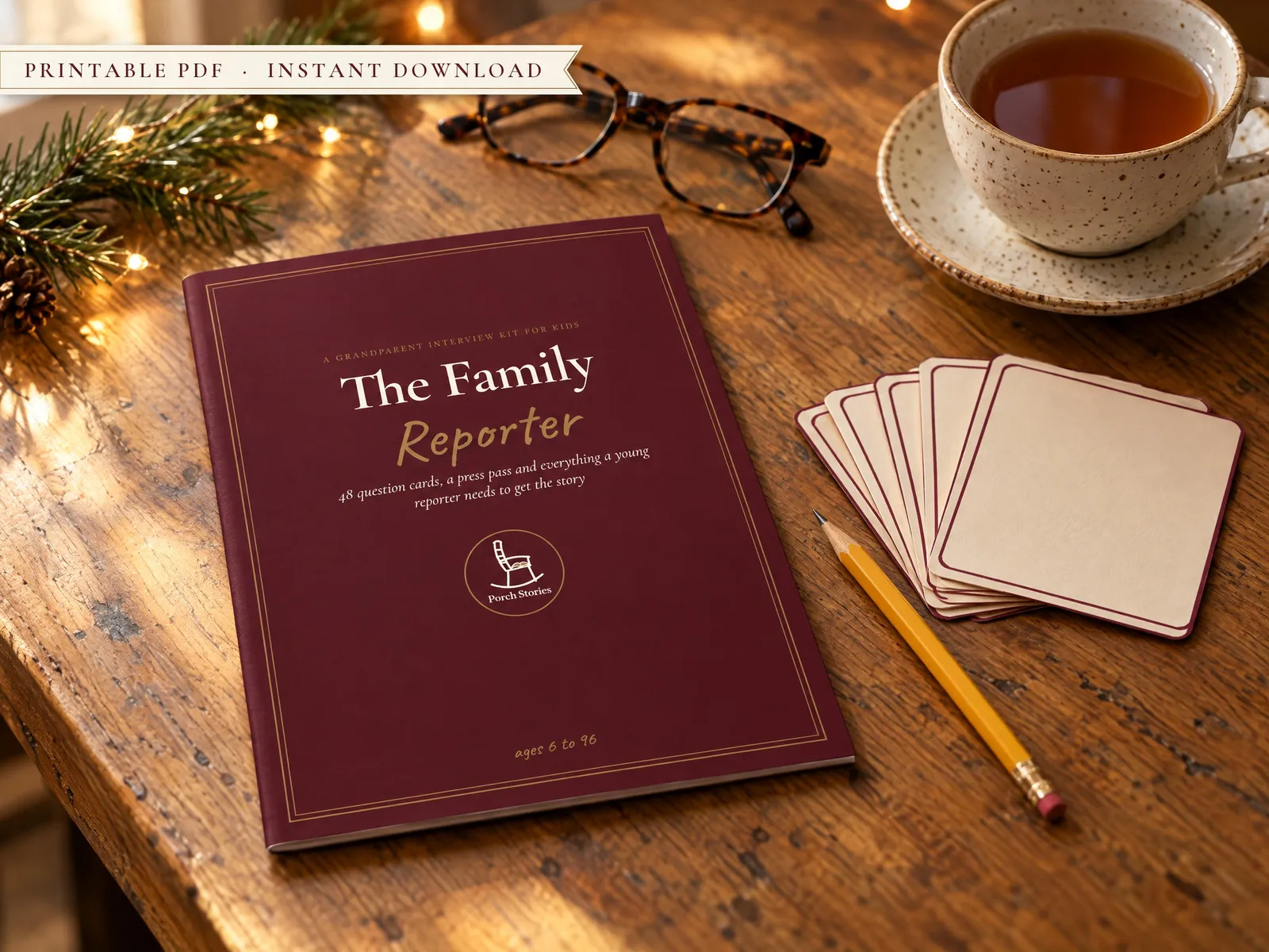 The Family Reporter kit with question cards and a pencil on a wooden table